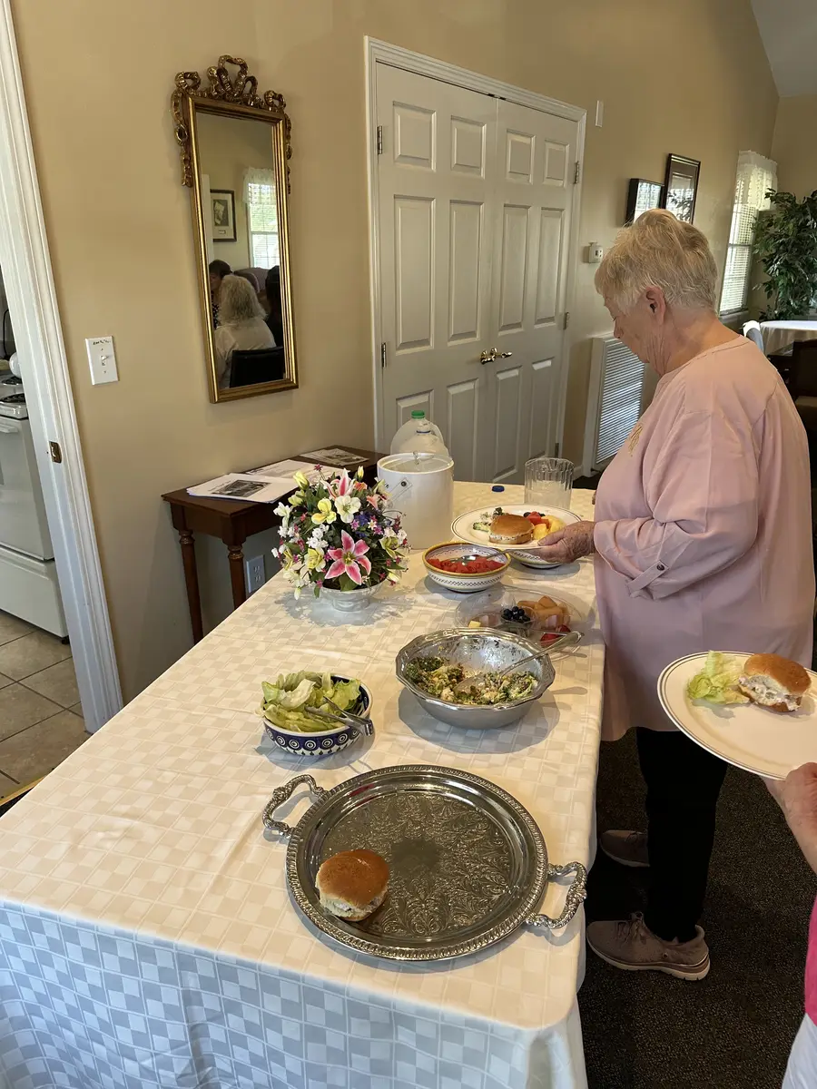 A member serving herself from the lunch buffet