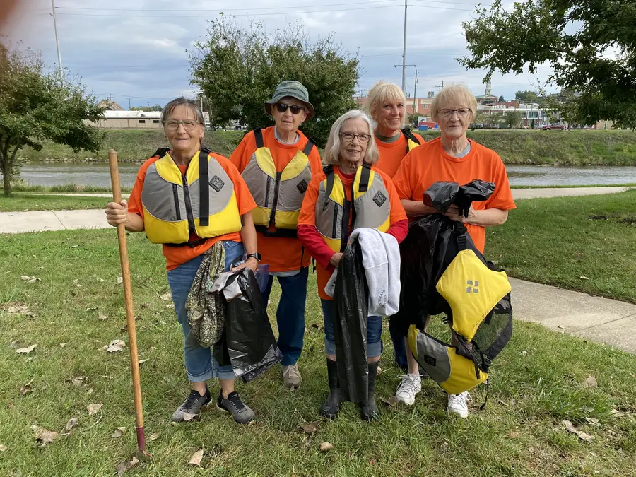 Cleanup volunteers gathered on the riverbank
